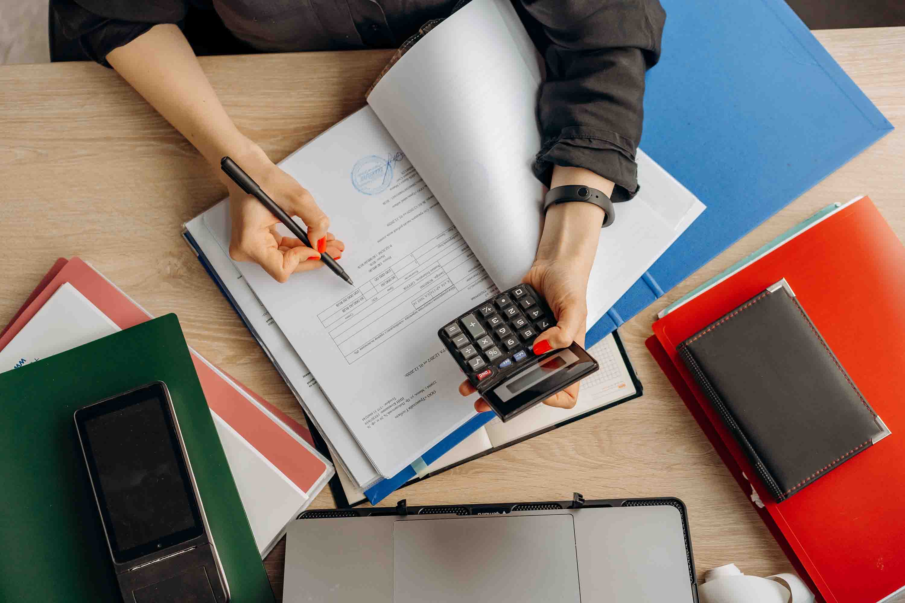 Accounting calculating the taxes - Photo by Mikhail Nilov